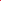 Close-up of Soft Tulle - Teaberry by Super Cheap Fabrics, 150cm wide. The textured red surface features a subtle diamond mesh pattern, and lighting highlights the airy, lightweight quality typical of tulle fabric.