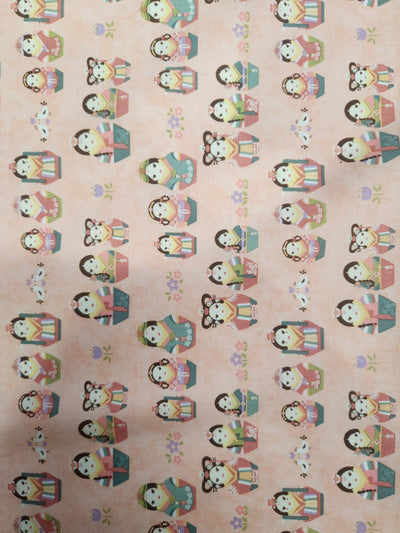 Printed cotton by Super Cheap Fabrics, named Authentic Pink - 113cm, features rows of kokeshi dolls in various traditional Japanese attire on a peach-colored background adorned with small flowers. Each cute, cartoon-like doll holds different accessories, making it perfect for crafting or as inspiration for your 100% cotton quilting projects.