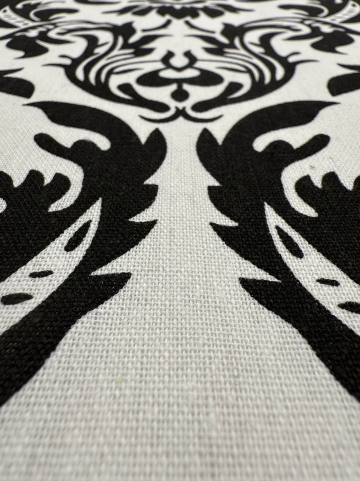 Close-up of Super Cheap Fabrics' Printed Linen Blend - Baroque Noir (145cm), featuring a black and white baroque damask on textured cotton linen—ideal for chic summer jackets.