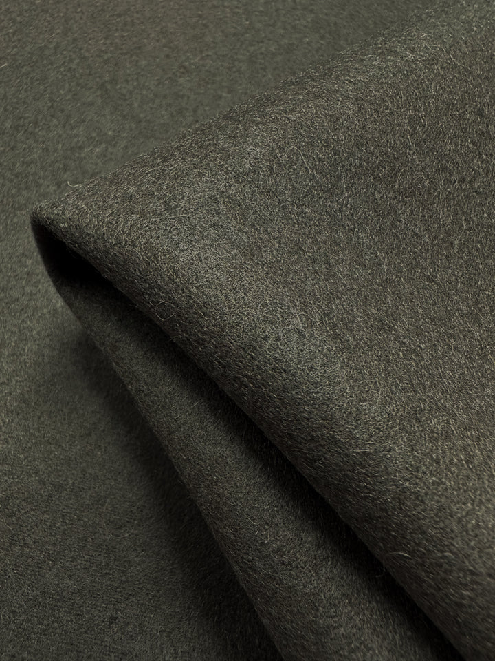 Close-up of folded Melton Wool - Major Brown by Super Cheap Fabrics, measuring 152cm. It features a soft, fibrous texture with subtle shading variations, neatly arranged to showcase its thickness and smooth surface.