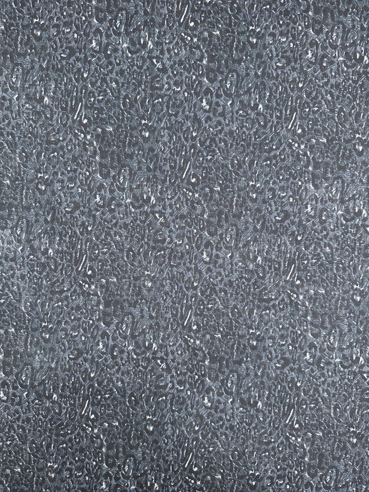 A close-up of a textured surface featuring an intricate, abstract pattern in shades of gray and white, reminiscent of the **Linen Blend - Cool Jungle - 140cm** fabric by **Super Cheap Fabrics**. The design evokes a leopard print or natural stone texture, creating a visually complex and breathable appearance perfect for summer outfits.