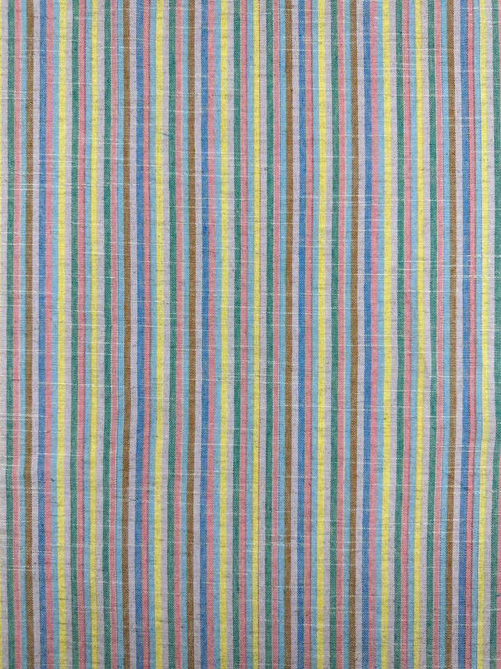 The Linen Blend - Tropicana by Super Cheap Fabrics is a vibrant yarn-dyed fabric with evenly spaced vertical stripes in blue, green, yellow, and pink. Its linen-like texture and vintage look create a colorful and lively pattern across the 143cm-wide fabric.