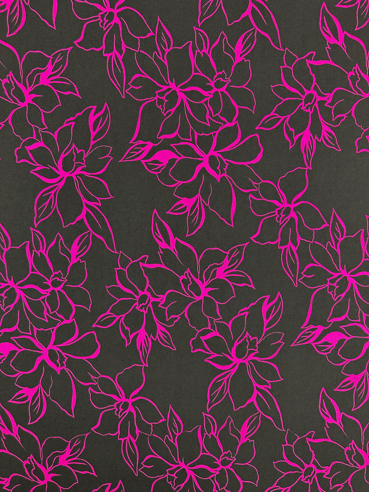 This design features intricate bright fuchsia flowers and leaves on a dark background, with vibrant symmetry on the Polyester/Spandex fabric. The bold contrast and two-way stretch of Printed Lycra - Devour - 145cm by Super Cheap Fabrics enhance its allure.