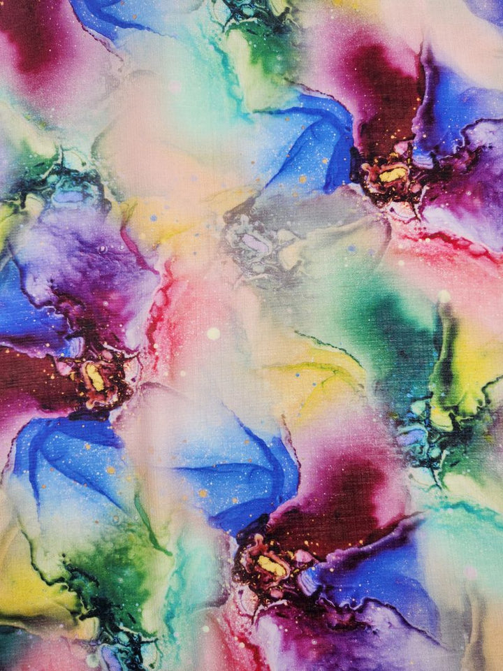 A vibrant abstract painting depicting swirling patterns of bright colors such as blue, purple, yellow, and green. The artwork evokes a cosmic scene with the fluidity and elegance reminiscent of luxury sewing projects crafted using Super Cheap Fabrics' Designer Cotton - Saphira - 150cm.